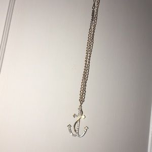 Gold anchor necklace.